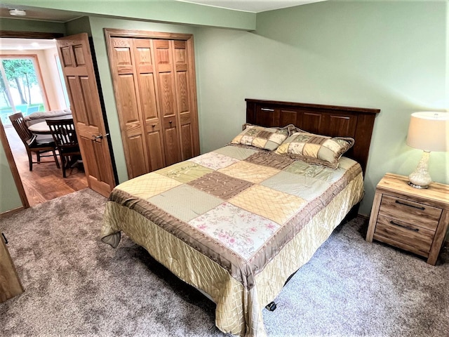 carpeted bedroom with a closet