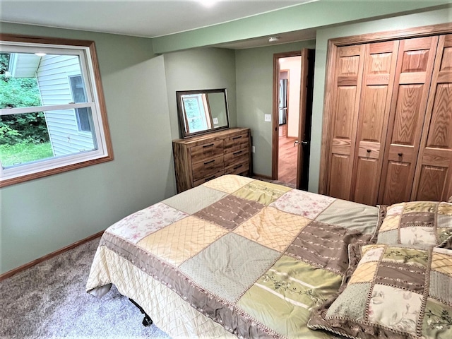 bedroom featuring a closet and carpet