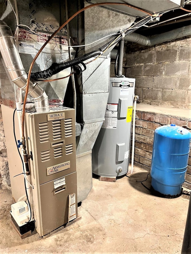 utility room with water heater and heating unit