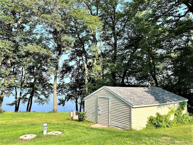 view of outbuilding with a lawn