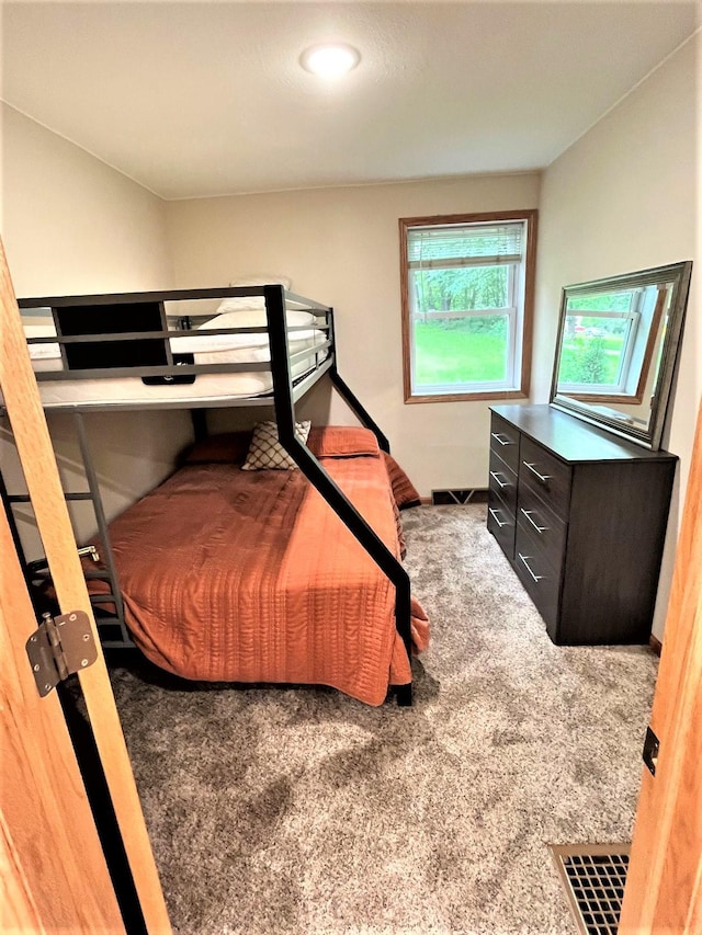 carpeted bedroom with visible vents