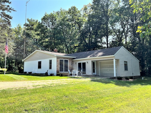 single story home with roof with shingles, a chimney, a front yard, entry steps, and a patio area