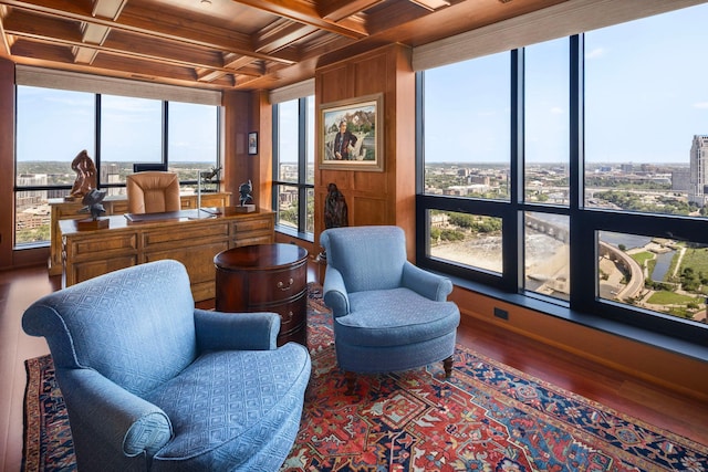 interior space featuring coffered ceiling, hardwood / wood-style floors, wooden walls, and beamed ceiling