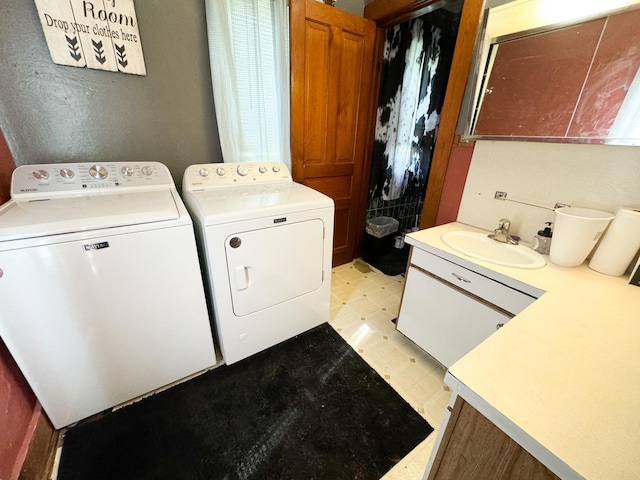 clothes washing area featuring sink and independent washer and dryer