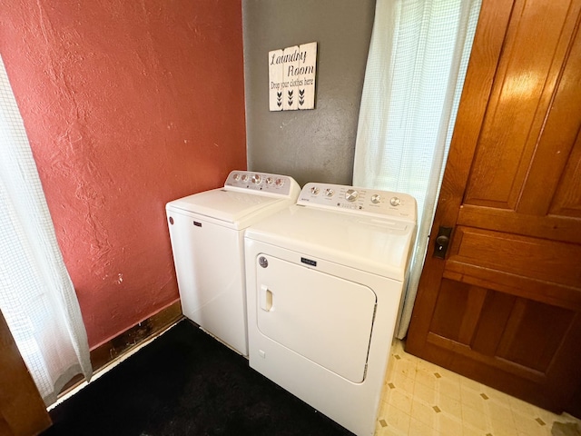 laundry area with washing machine and dryer