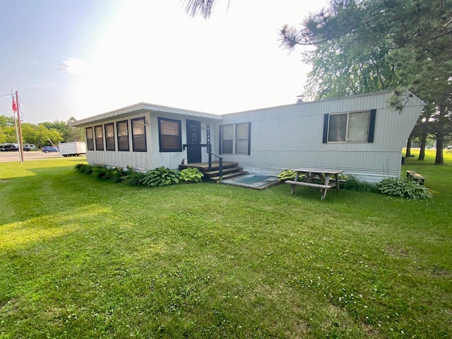 LOT178 28th, Baudette Twp, MN 56623 - rear view of house featuring a lawn