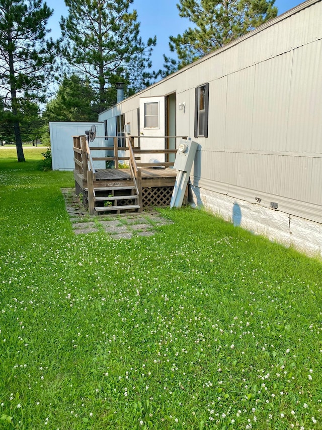 view of yard featuring a wooden deck