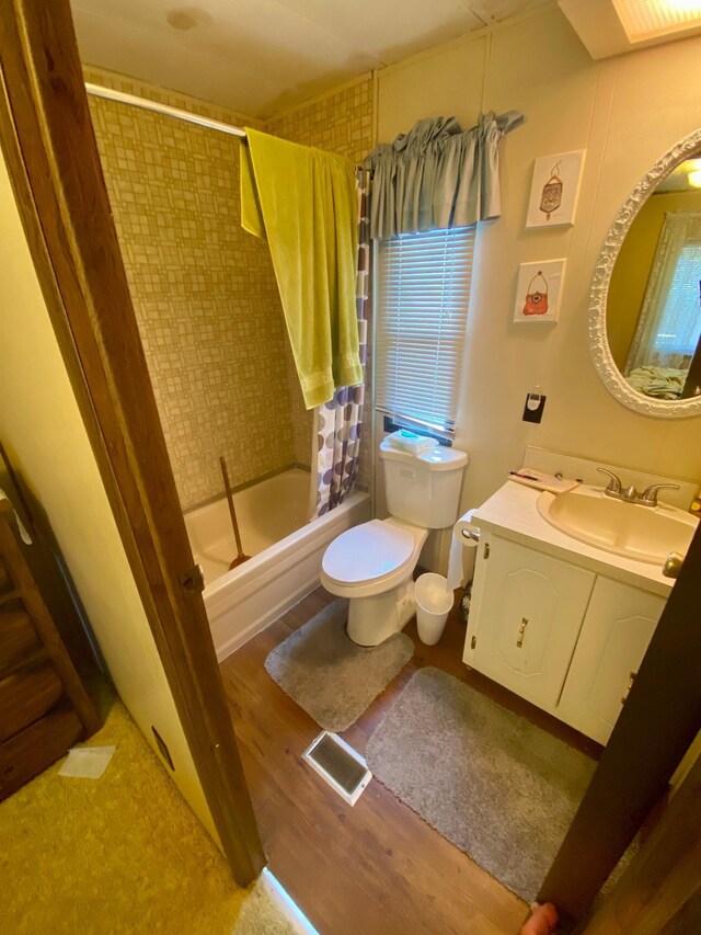 LOT178 28th, Baudette Twp, MN 56623 - full bath featuring toilet, vanity, wood finished floors, and shower / bath combo with shower curtain