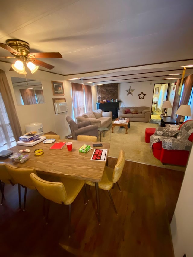 dining area with ceiling fan and hardwood / wood-style flooring