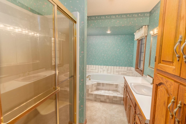 bathroom featuring separate shower and tub and vanity