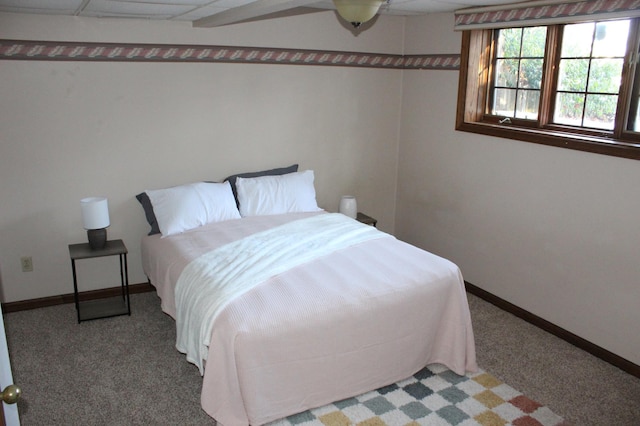 bedroom featuring ceiling fan and carpet flooring