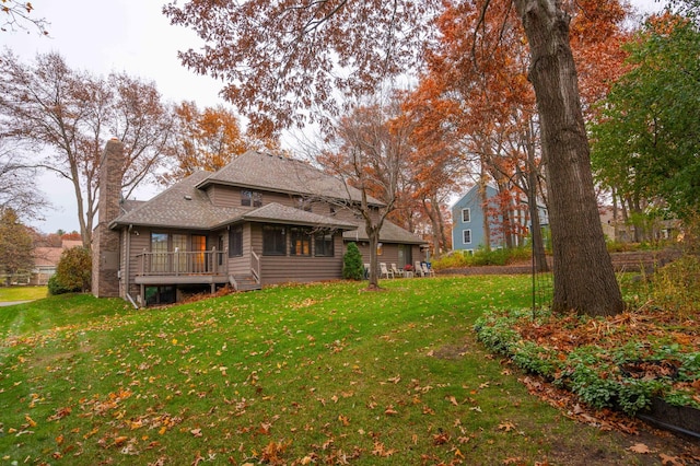 rear view of house with a yard