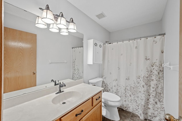 full bathroom with a shower with curtain, visible vents, toilet, vanity, and tile patterned flooring