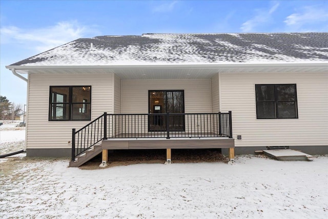 snow covered property featuring a porch