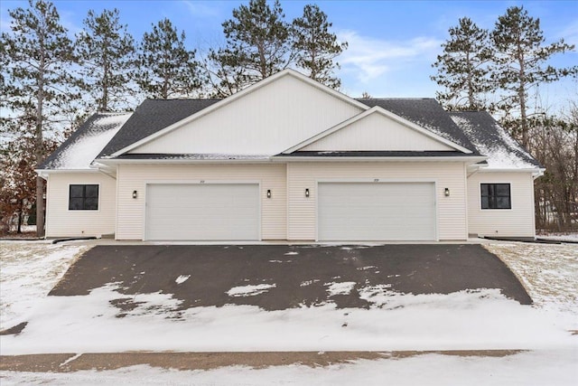 view of front of property with a garage