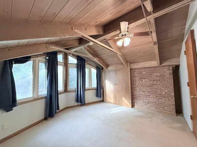 additional living space featuring carpet floors, vaulted ceiling with beams, plenty of natural light, and wooden ceiling