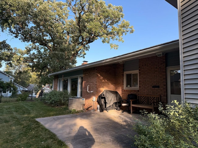 exterior space with central AC unit and a grill