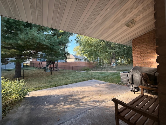 view of patio featuring area for grilling and a playground