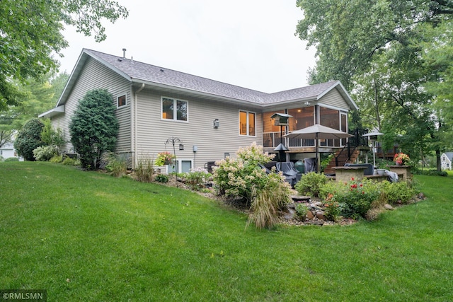 back of house with a lawn and a wooden deck