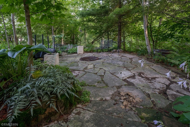 view of patio / terrace with an outdoor fire pit