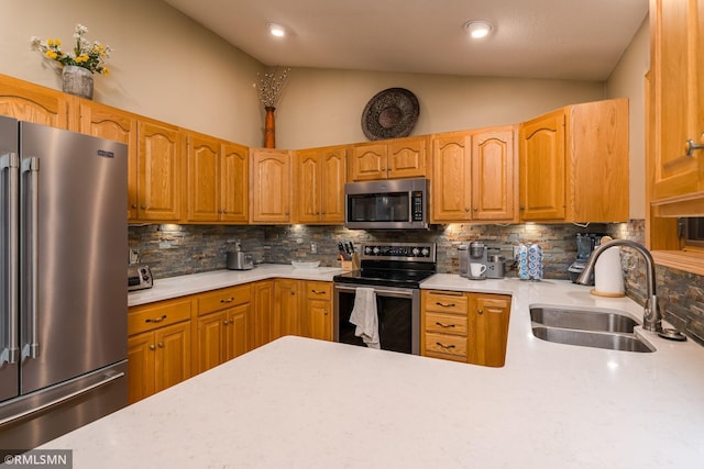 kitchen featuring appliances with stainless steel finishes, decorative backsplash, sink, and high vaulted ceiling