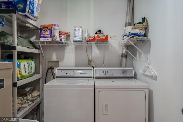 laundry room featuring separate washer and dryer