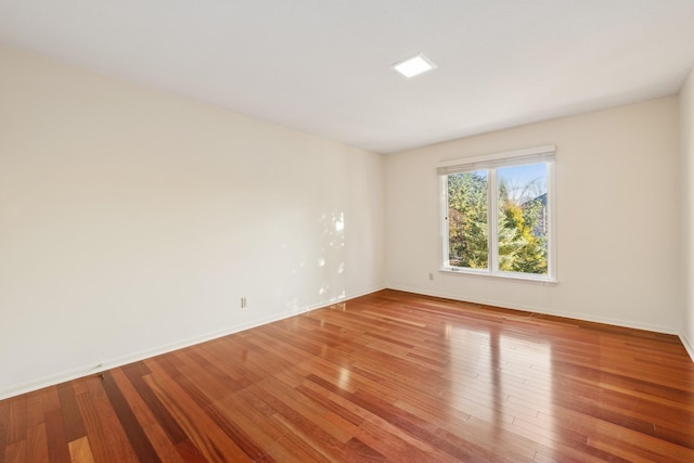 empty room featuring hardwood / wood-style flooring