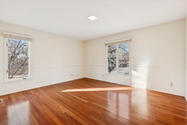 empty room with wood-type flooring