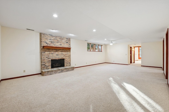 unfurnished living room featuring a fireplace and light carpet