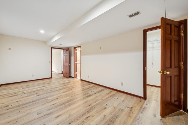 empty room with light hardwood / wood-style floors