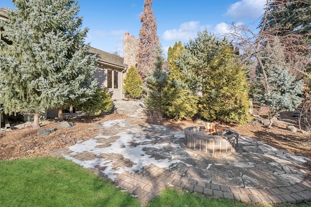 view of yard featuring a patio area and an outdoor fire pit