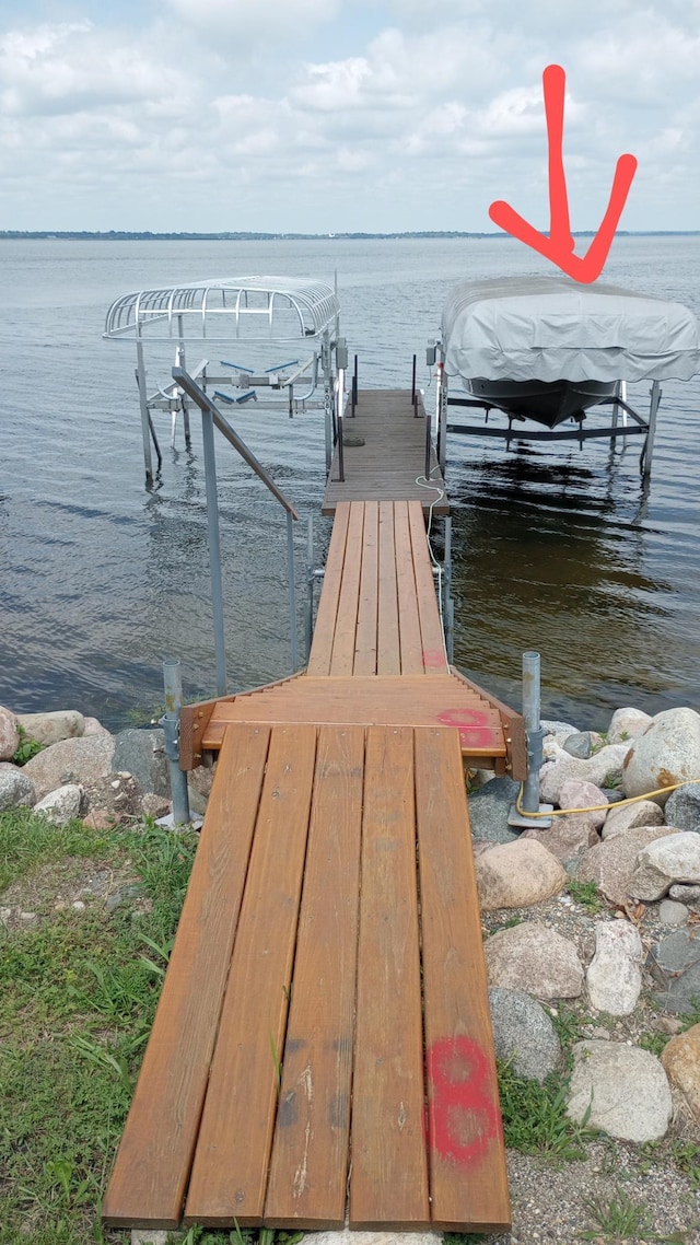 view of dock with a water view