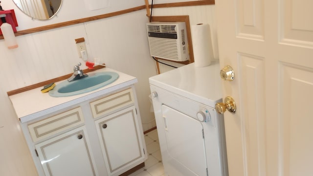 bathroom with vanity, a wall mounted AC, and tile patterned floors