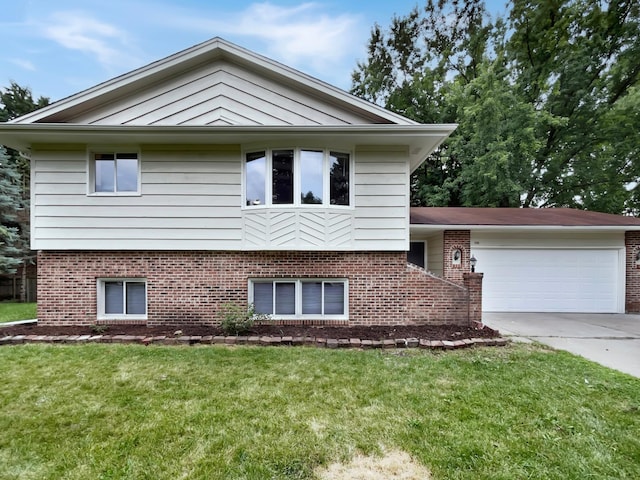 view of front of home with a garage and a front yard