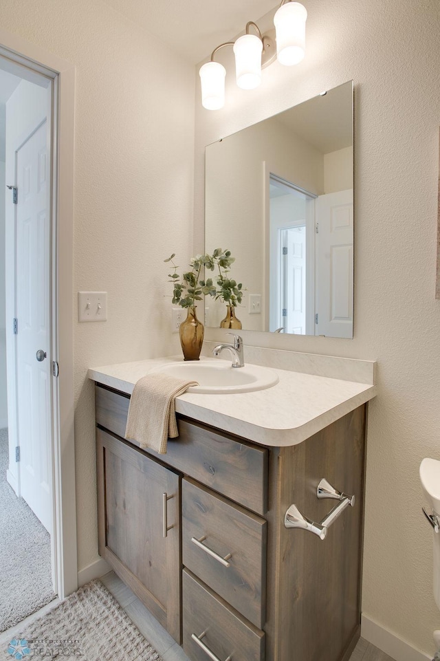 bathroom with vanity and tile patterned flooring