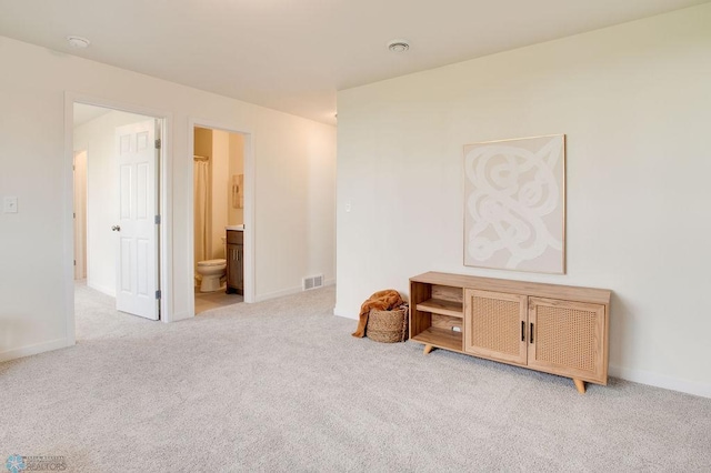 interior space featuring light colored carpet