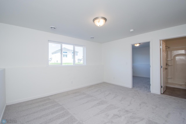 interior space featuring baseboards and carpet