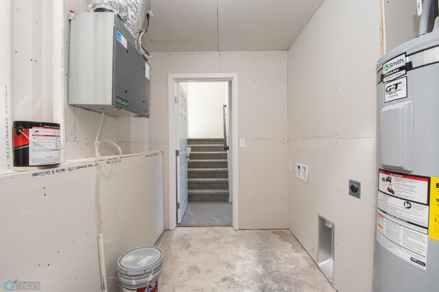 washroom with hookup for an electric dryer, laundry area, and electric water heater