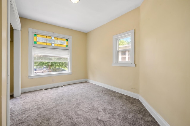 spare room featuring carpet floors