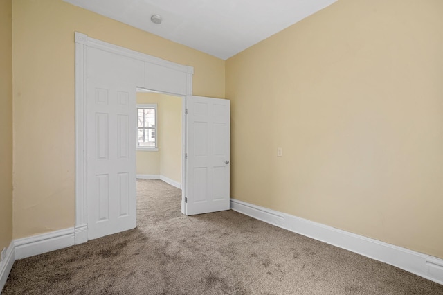 empty room featuring carpet floors