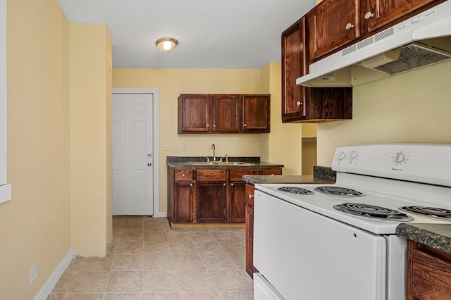 kitchen featuring sink, light tile patterned floors, and white electric range oven