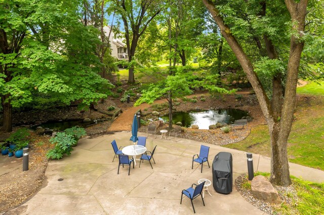 view of patio featuring a water view