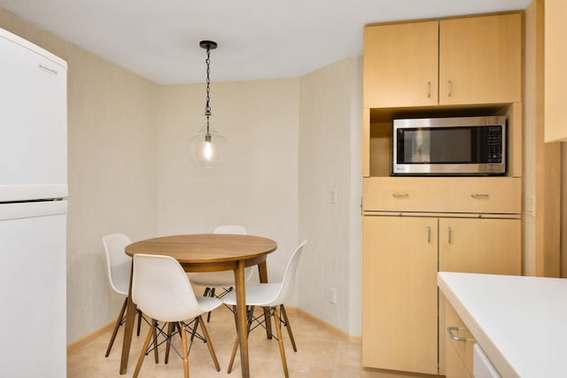 view of tiled dining space