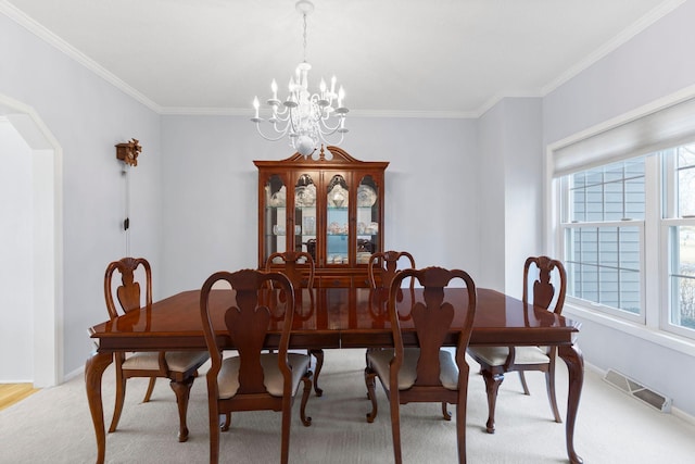 dining room with a chandelier, visible vents, baseboards, and a wealth of natural light