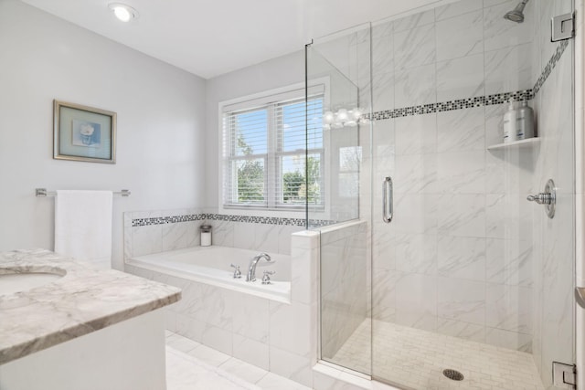 bathroom featuring vanity, a bath, and a stall shower