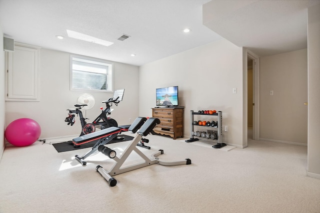 exercise area with visible vents, recessed lighting, carpet flooring, and baseboards