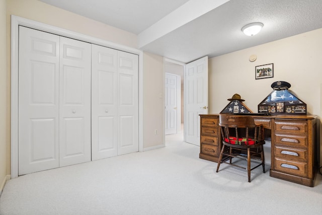 carpeted office featuring baseboards