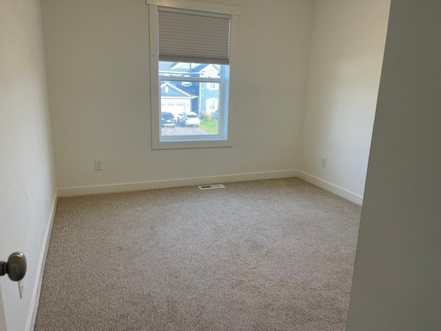 empty room featuring carpet flooring