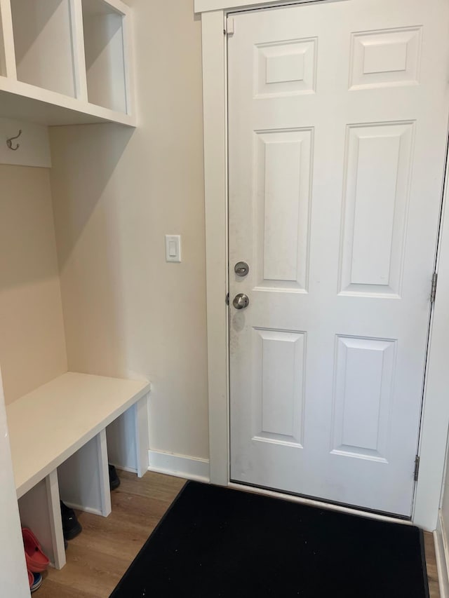 mudroom with wood-type flooring