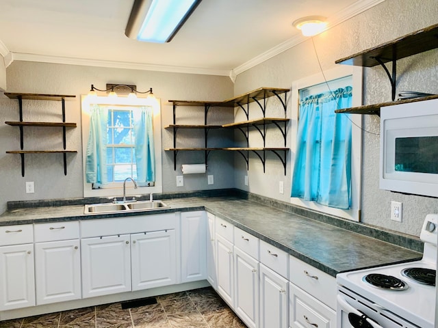 kitchen with dark tile patterned floors, white appliances, crown molding, sink, and white cabinets